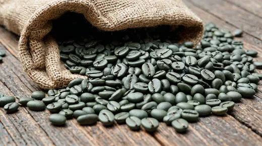A jute sack of raw green coffee beans