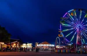 Ferris wheel with people standing