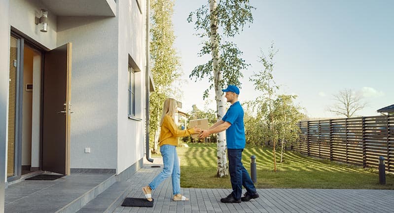 man making a delivery to a happy customer.