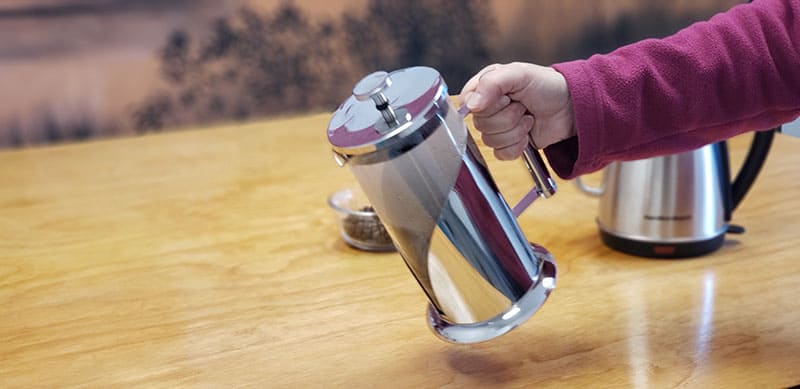 to equalize the temperature of your french press, swish hot water around inside of the empty press
